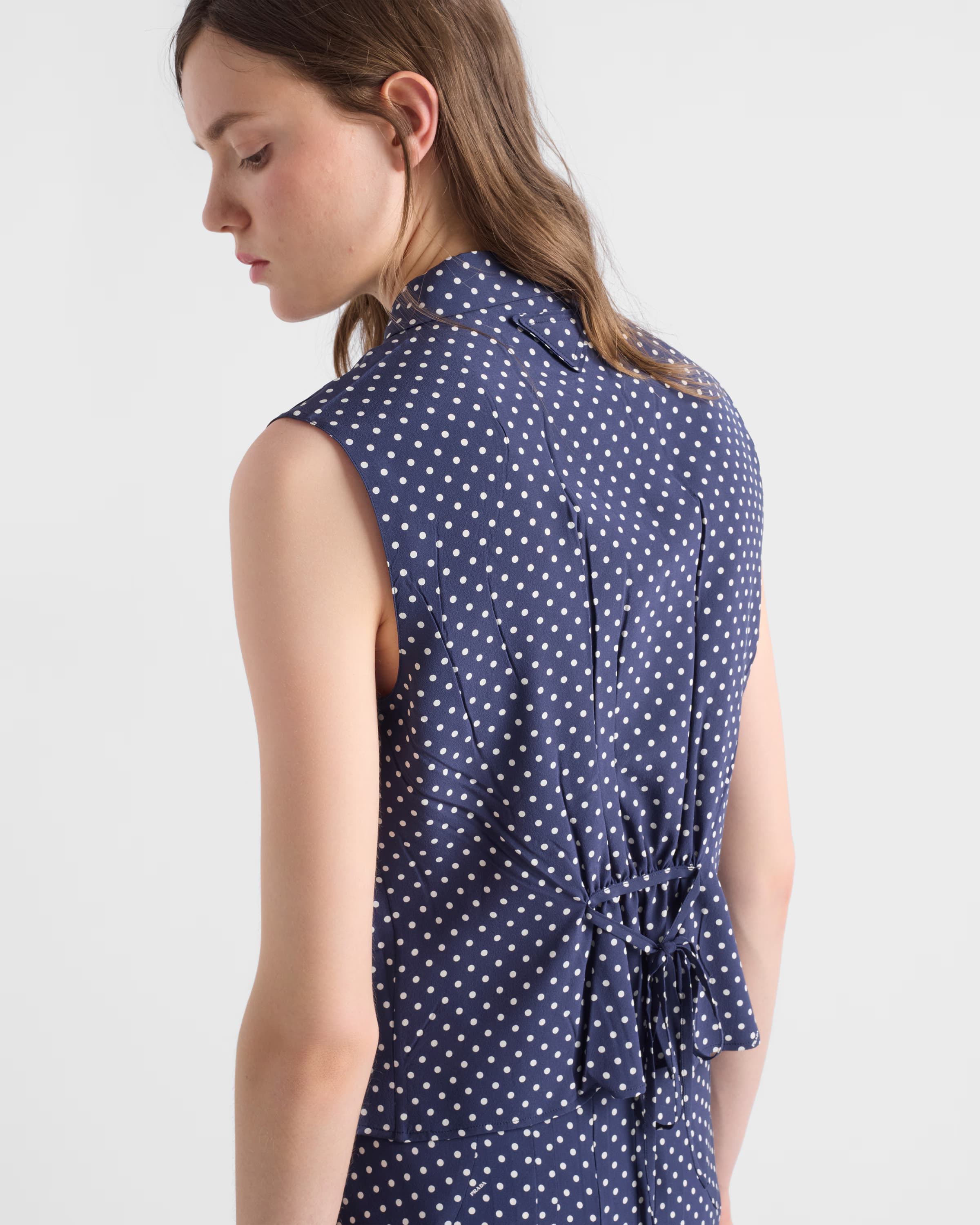 Sleeveless polka-dot marocain silk shirt
